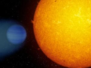 Representación artística de WASP-69b en la que se observa la cola planetaria formada por partículas de helio. / ©Gabriel Pérez Díaz (IAC)